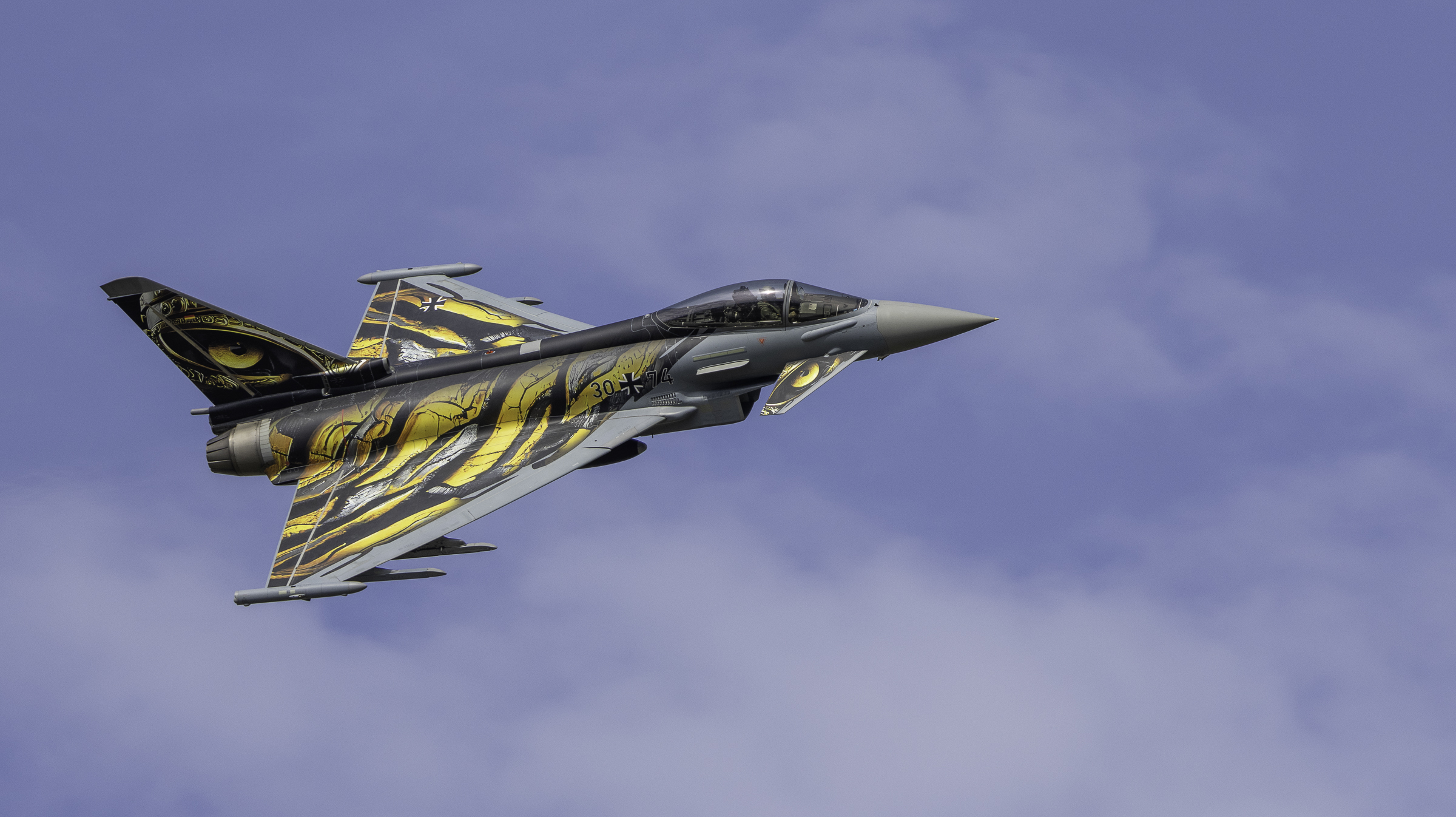 Eurofighter Typhoon 'Ghost Tiger' in level flight showing the tiger-eye tail art