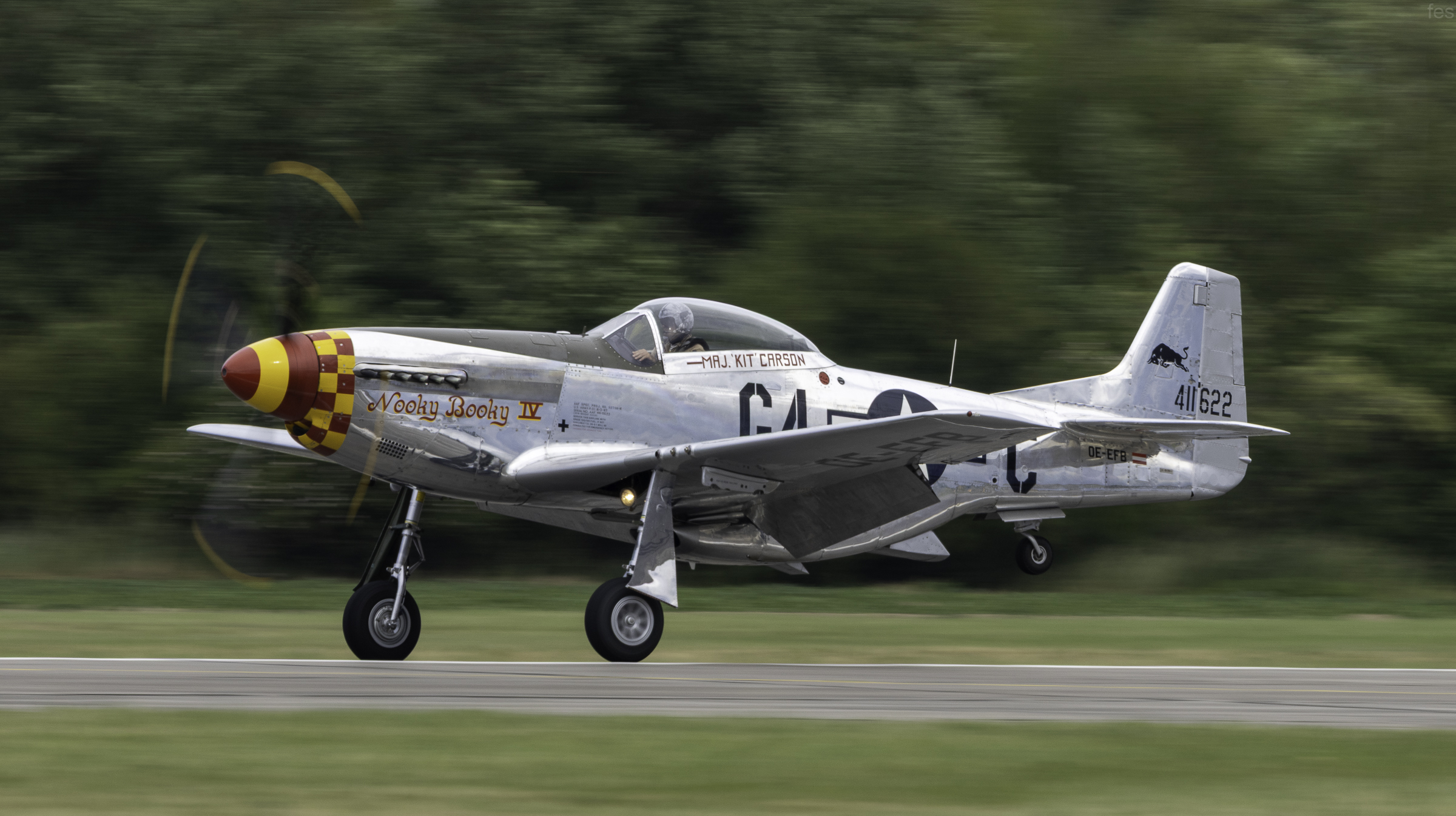 P-51D Mustang 'Nooky Booky IV' on its takeoff roll, panned with motion blur