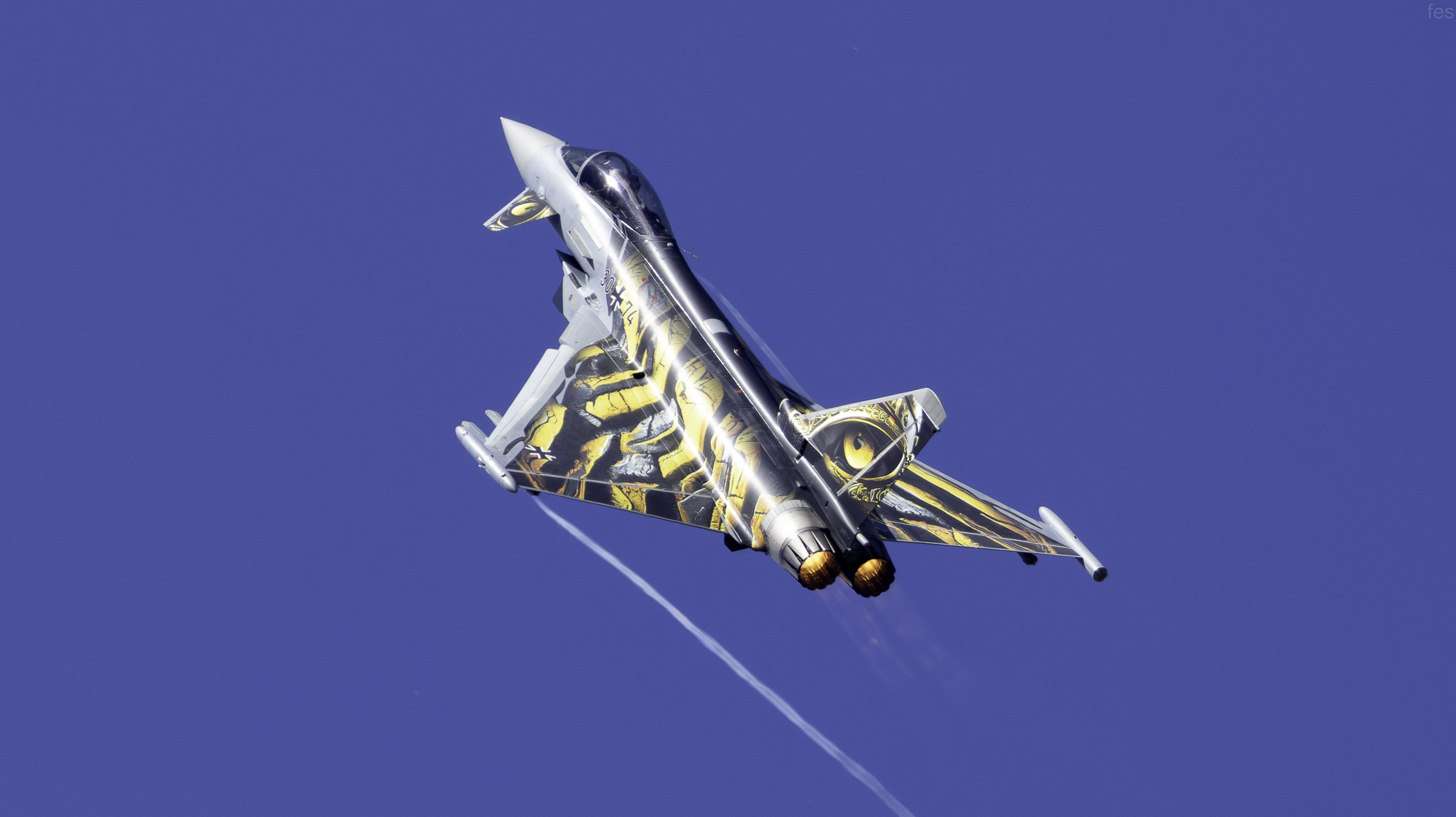 'Ghost Tiger' Typhoon climbing steeply with a contrail streaming off the wing