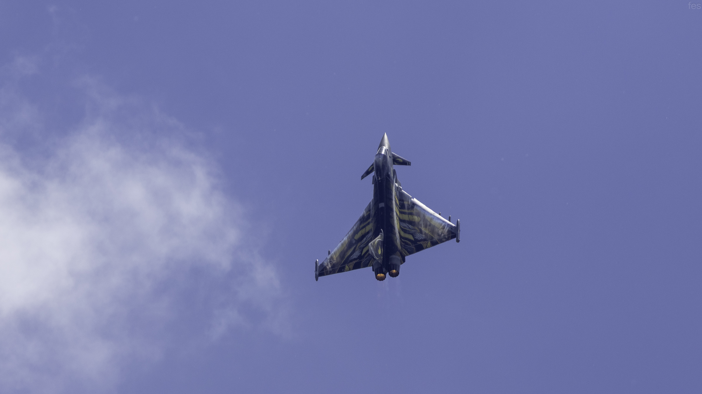 'Ghost Tiger' Typhoon passing overhead against scattered clouds